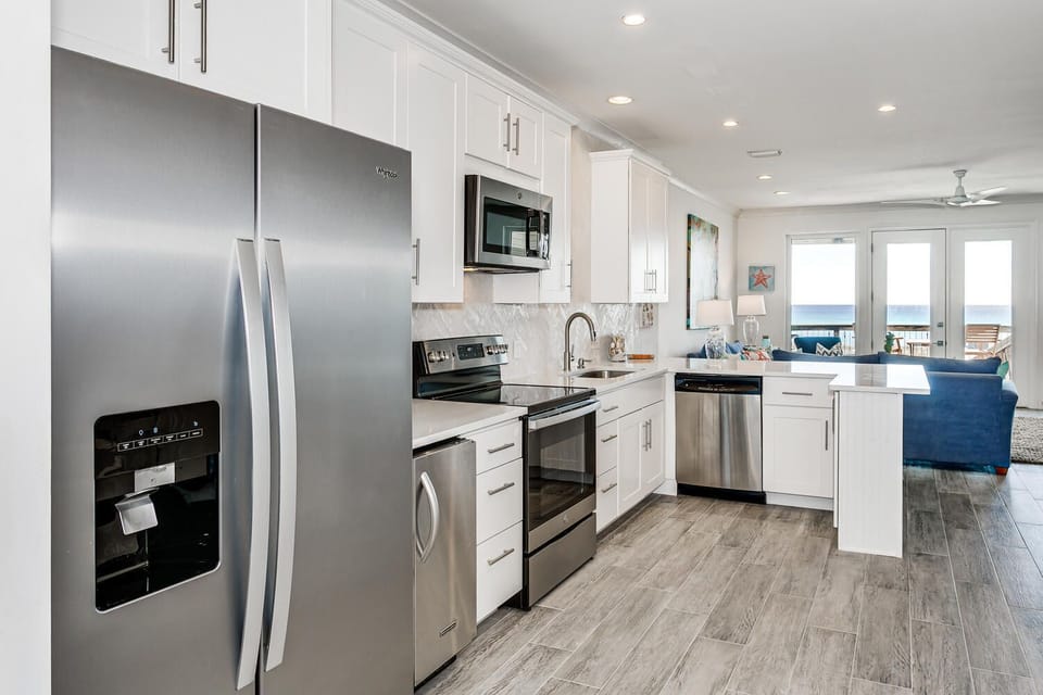 Kitchen flows into living space view a beautiful view!