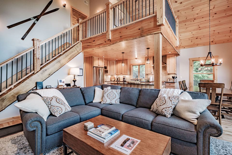 Another view of the great room showing loft sleeping area above.