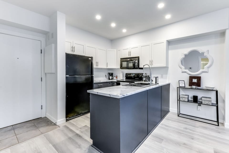 Fully stocked kitchen. Refrigerator, stove/oven, microwave and dishwasher. 