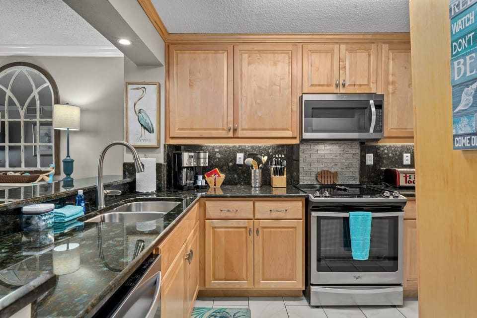 This beautiful kitchen makes vacation living easy, with plenty of space to cook breakfast, prep beach snacks, or wind down with dinner after a day in the sun. Fully furnished and thoughtfully stocked, it’s both stylish and practical for your stay.