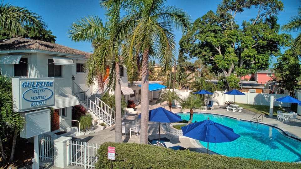 View of pool and units 1-6 on the left