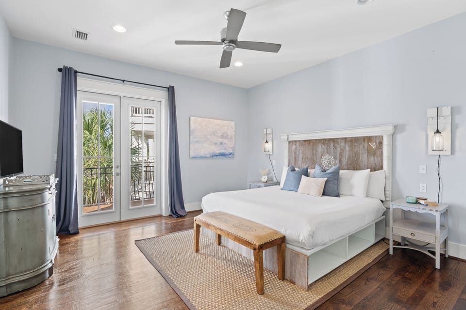 The primary bedroom (Bedroom 4) features a king bed, TV, private balcony and an ensuite bathroom. (2nd floor)