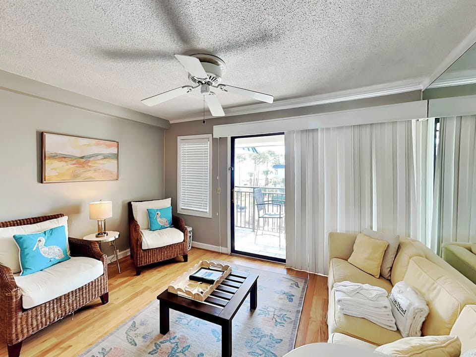 Living Area - Sleeper Sofa, Smart TV & Balcony Access