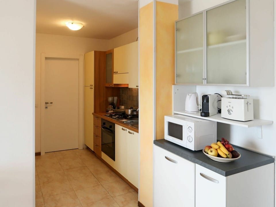 Cabinetry, Countertop, Property, Furniture, Kitchen Appliance, Home Appliance, Kitchen, Kitchen Stove, Building, Wood