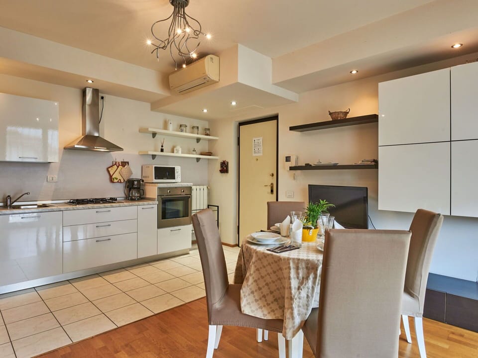 Furniture, Countertop, Cabinetry, Table, Wood, Chair, Home Appliance, Lighting, Kitchen, Interior Design