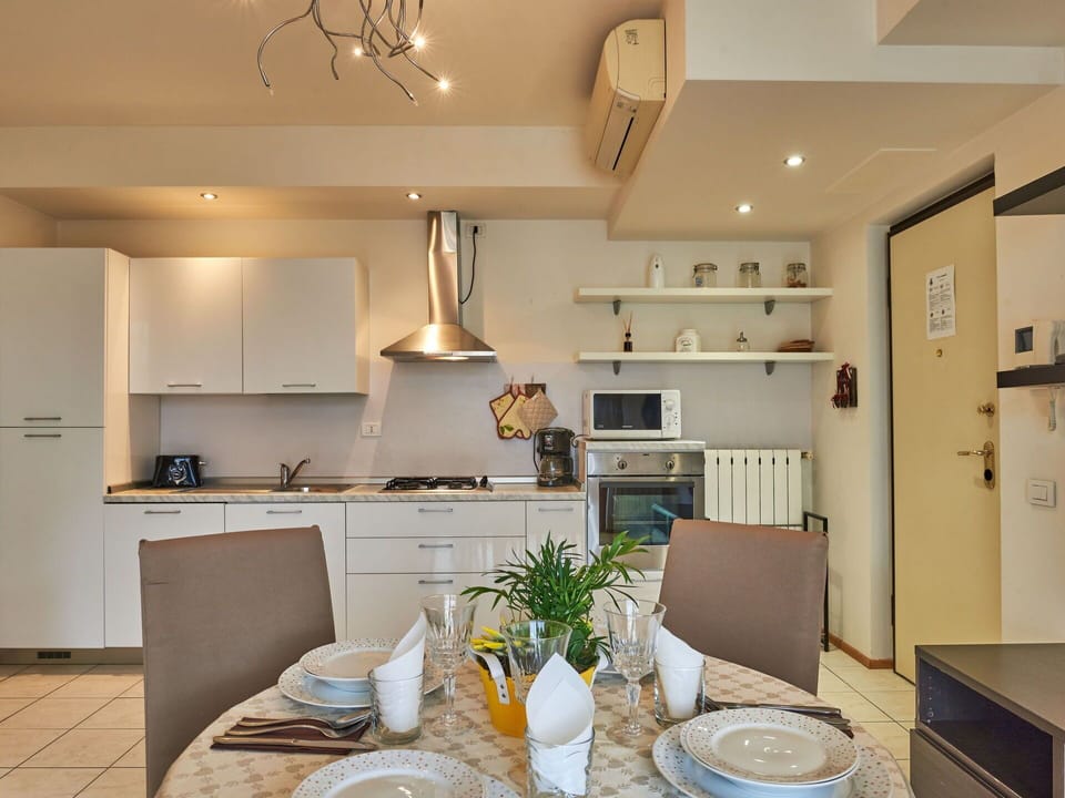 Property, Cabinetry, Countertop, Kitchen, Wood, Interior Design, Lighting, Tableware, Floor