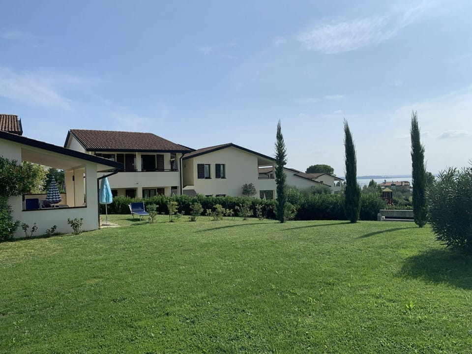 Sky, Plant, Cloud, Building, Window, Tree, Land Lot, Vegetation, Natural Landscape, House