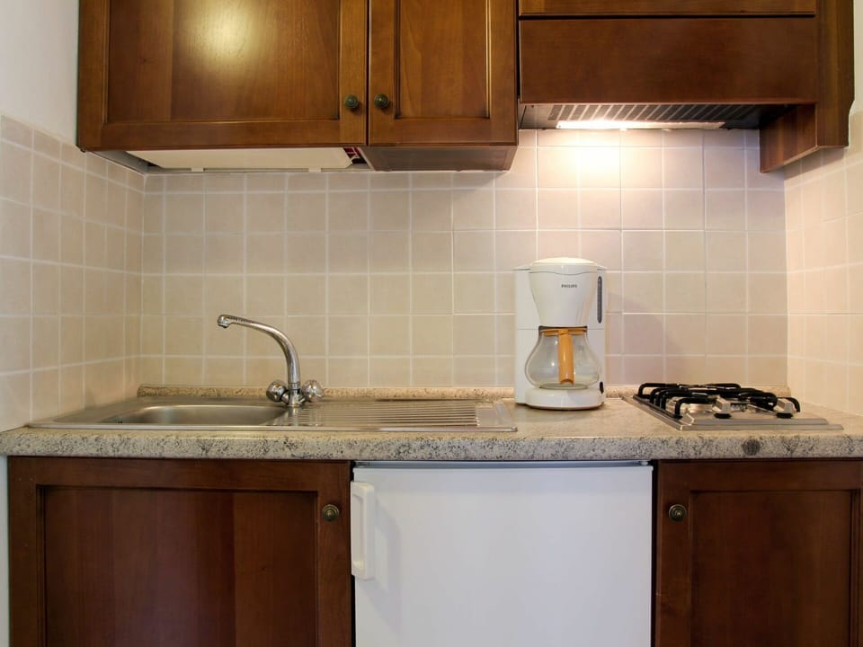 Countertop, Cabinetry, Room, Property, Tile, Kitchen, Furniture, Sink, Lighting, Interior Design