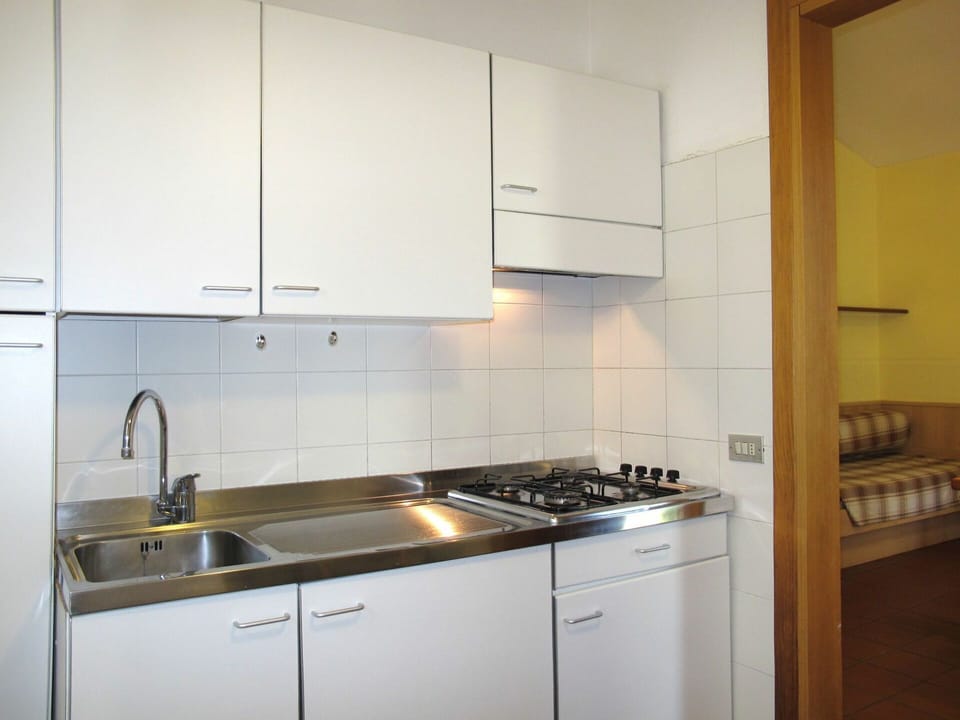 Countertop, Kitchen, Property, Room, Cabinetry, Furniture, Kitchen Stove, Major Appliance, Tile, Interior Design