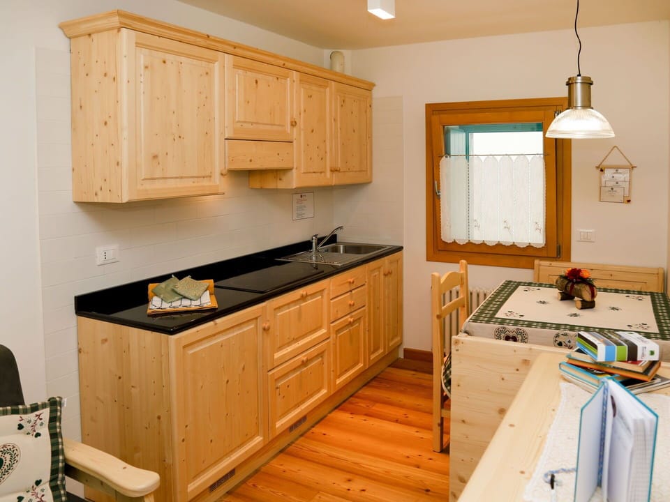 Countertop, Cabinetry, Property, Furniture, Sink, Kitchen, Drawer, Wood, Lighting, Interior Design