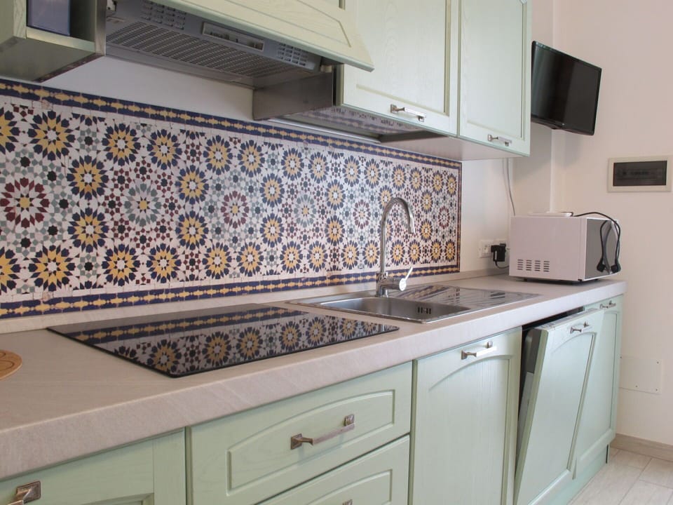 Kitchen, Interior Design, Flooring, Countertop, Floor, Tile, Tap, Cabinetry, Plumbing Fixture, Kitchen Appliance