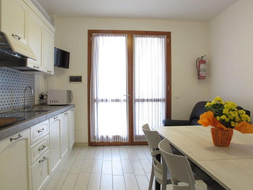 Furniture, Interior Design, Flooring, Wood, Floor, Room, Kitchen & Dining Room Table, Countertop, Ceiling, Lighting