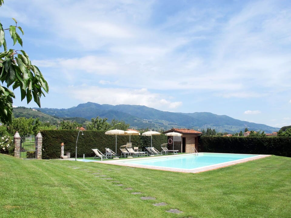 Cloud, Water, Sky, Plant, Building, Swimming Pool, Mountain, Natural Landscape, Land Lot, Outdoor Furniture