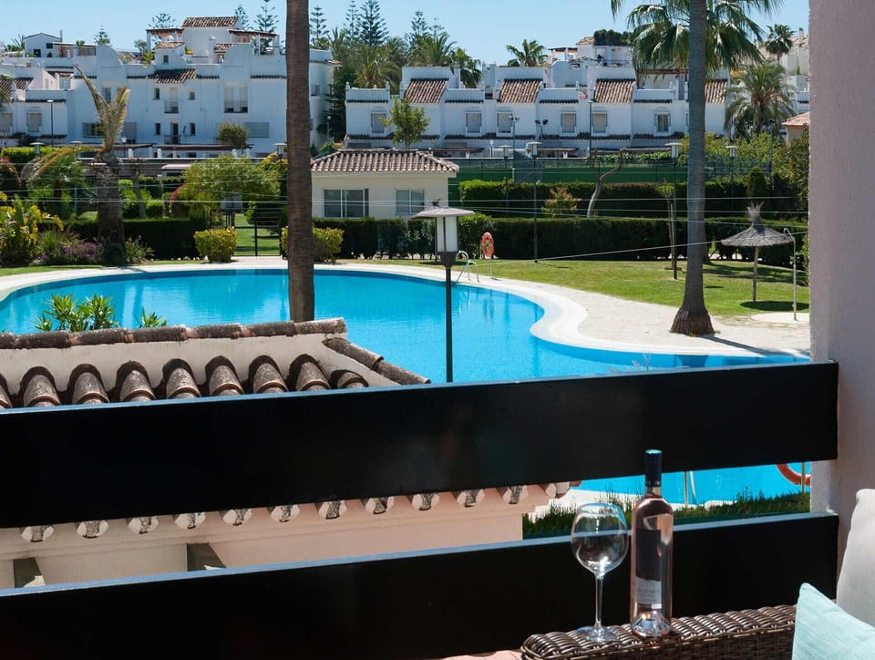 Cozy apartment terrace overlooking pool, Spain