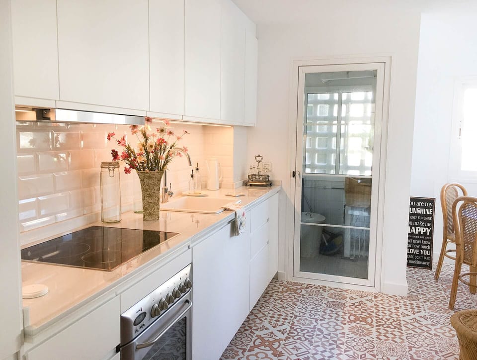 Fully equipped kitchen within vacation apartment with AC