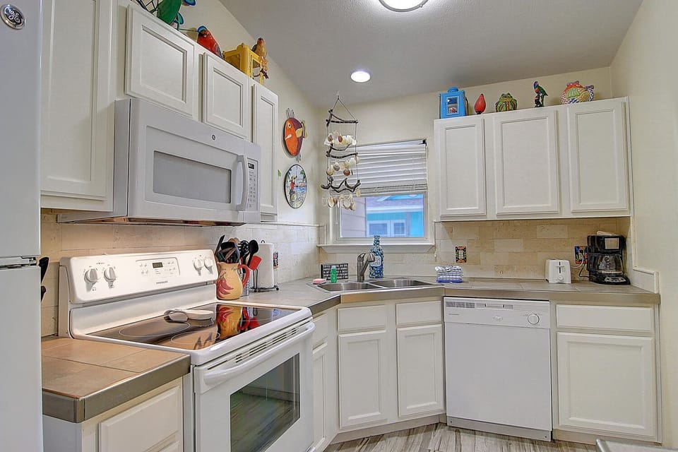 Your fully equipped kitchen awaits with everything needed to prepare meals, from morning coffee to home-cooked dinners during your stay.