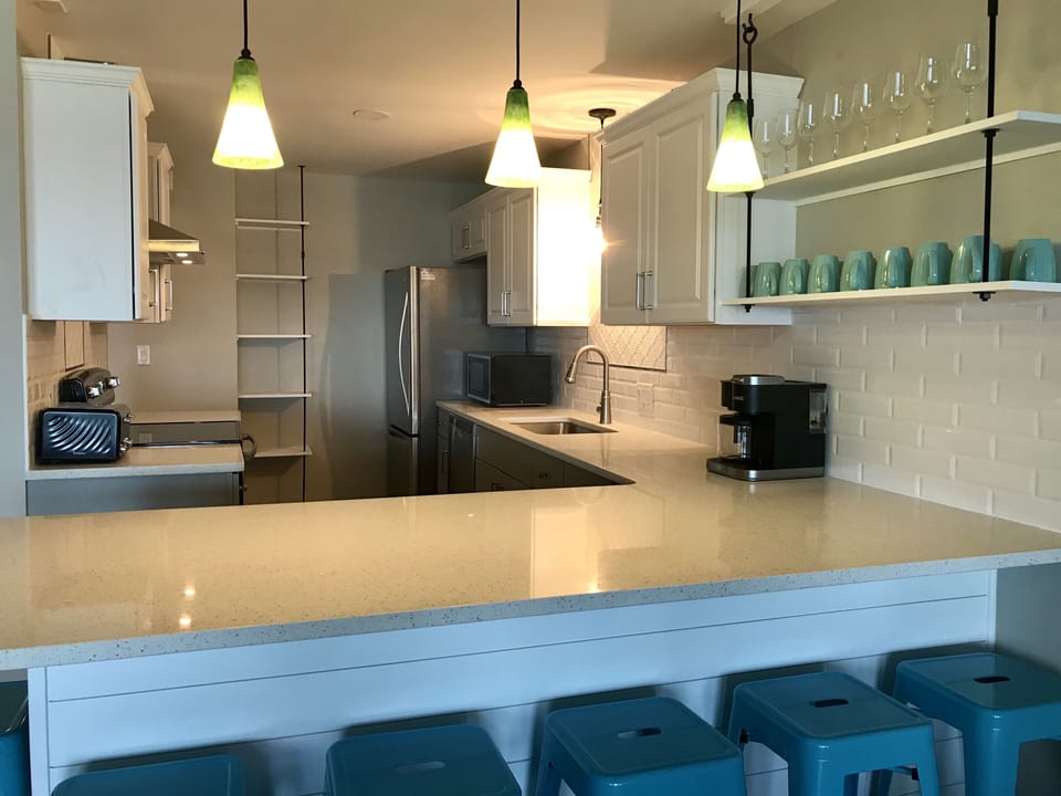 Gorgeous large open floor plan with coastal decor, main kitchen!