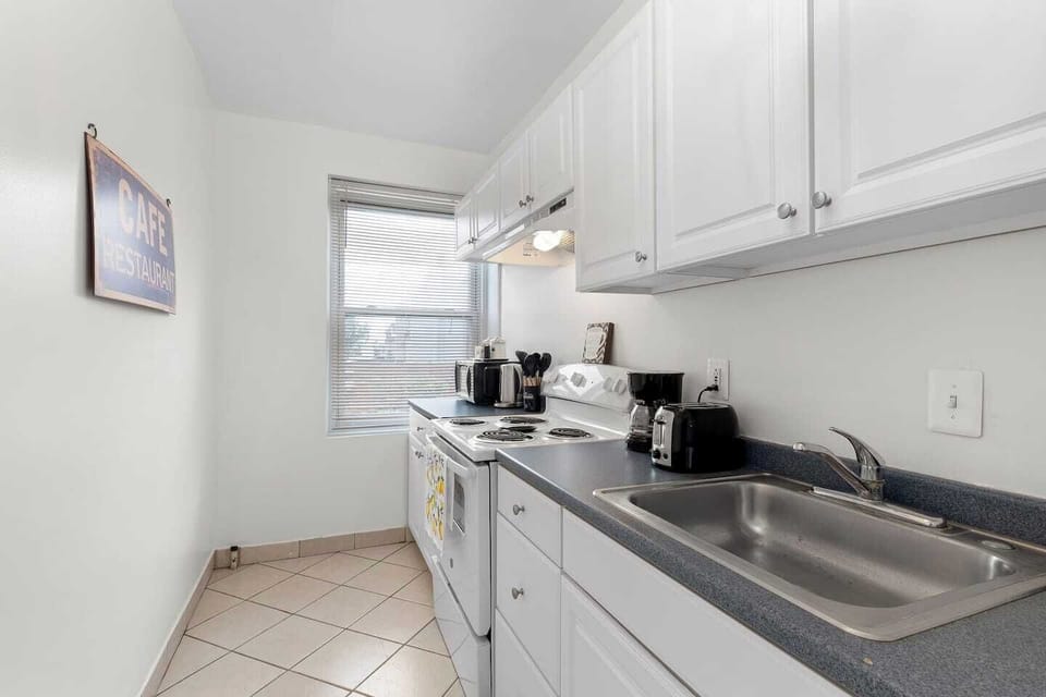 Fully equipped kitchen with modern appliances and ample counter space for all your cooking needs.