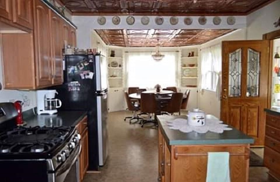 Grand kitchen and dining area with built into the floor round table lazy susan