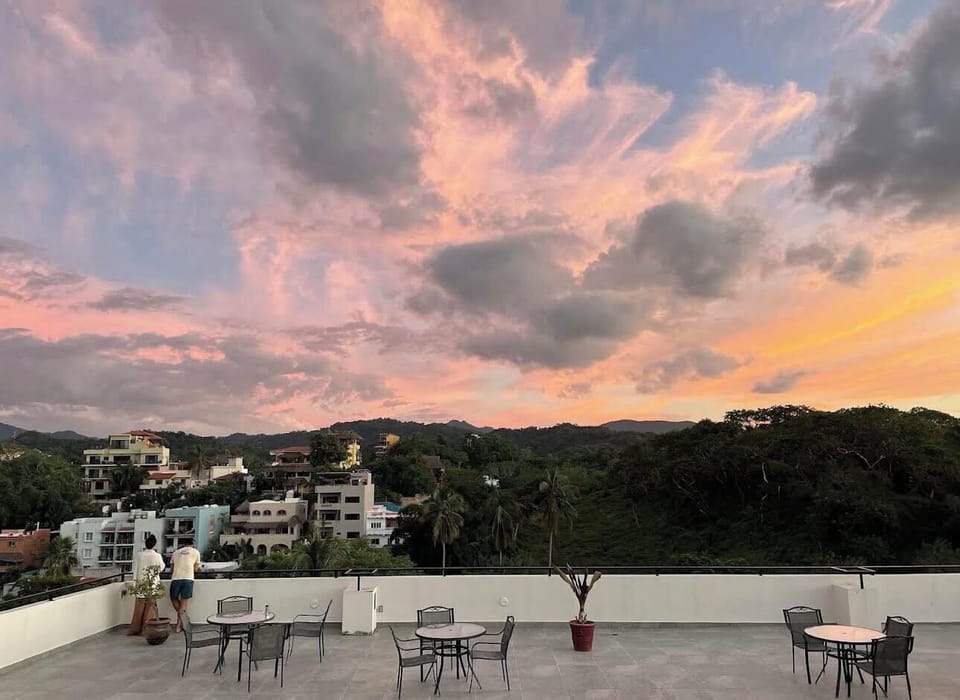 Enjoy colorful sunsets and stunning views right from our rooftop patio.