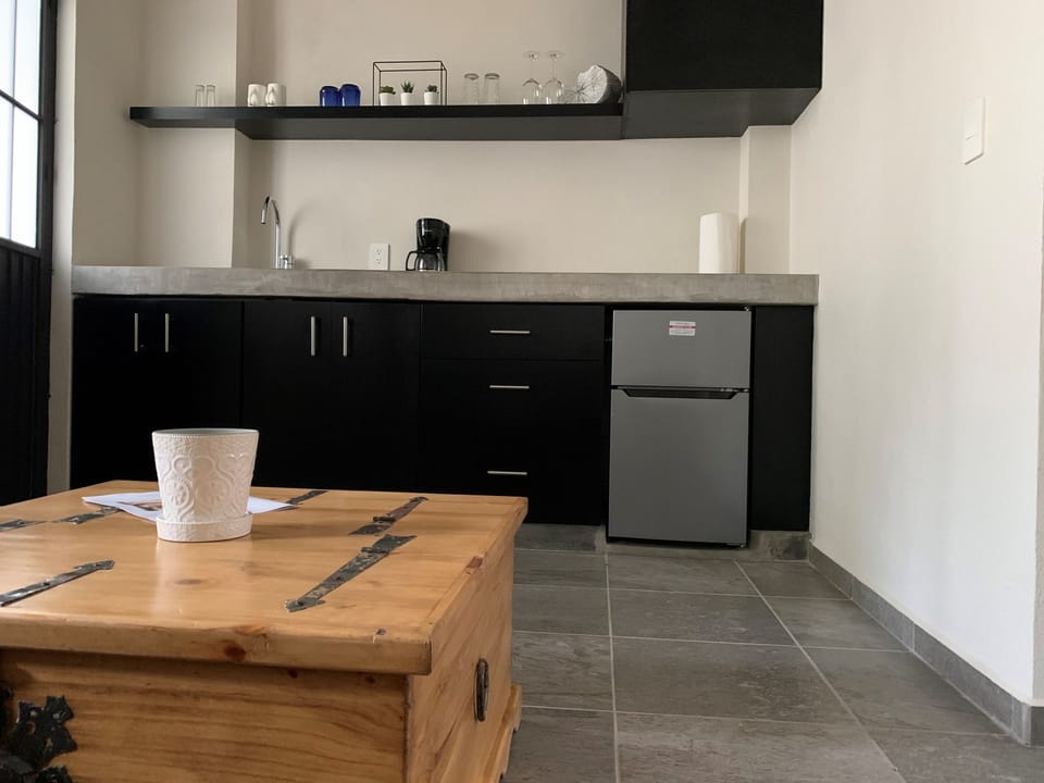 The small kitchenette features ample counter space for you to prepare drinks and snacks.