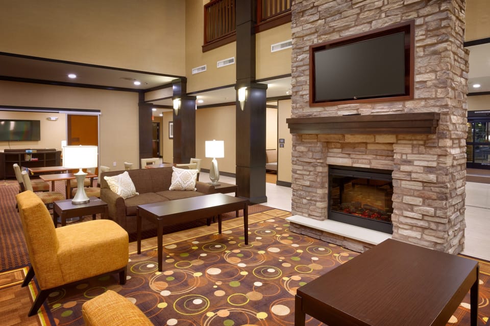Common lounge with comfortable seating and fireplace.