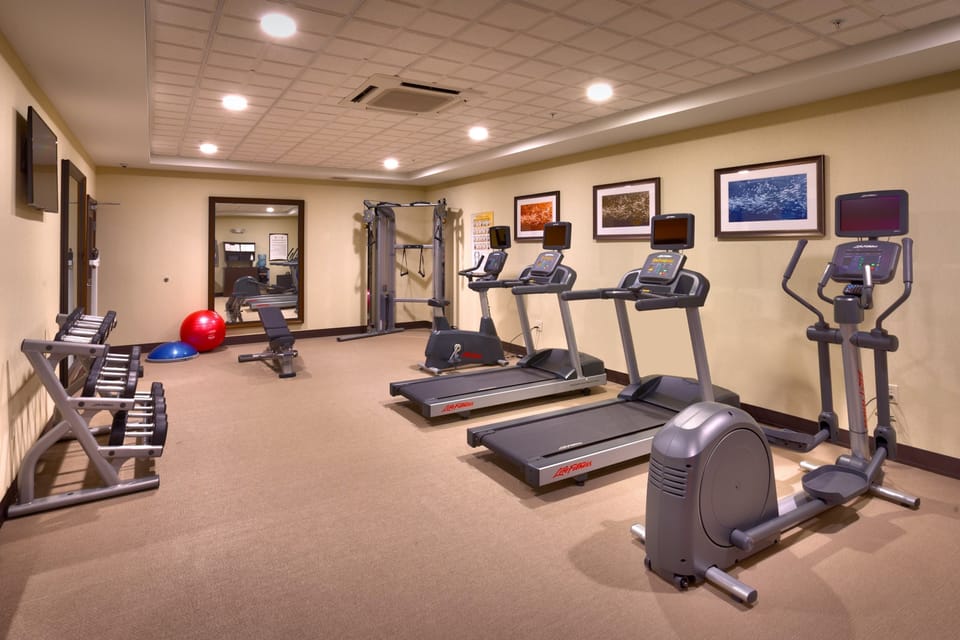Fitness center with treadmills and exercise equipment.