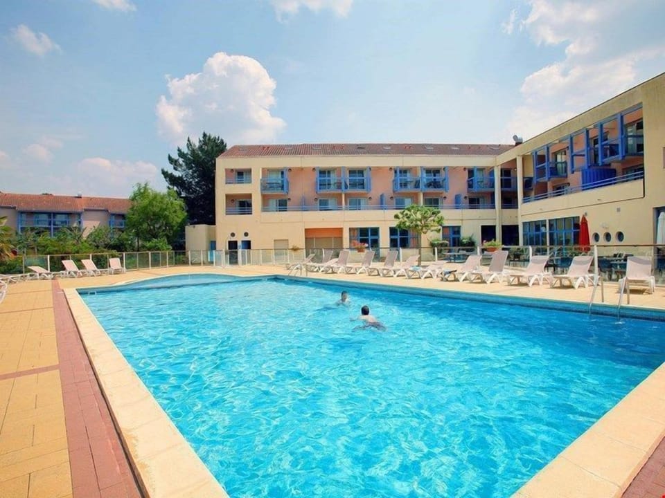 On days not spent by the sea, wade through the blue waters of the outdoor pool