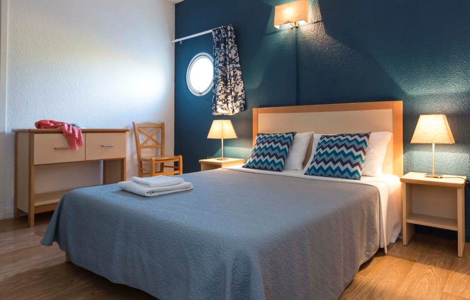 Relax on the comfy bed after a day outside.