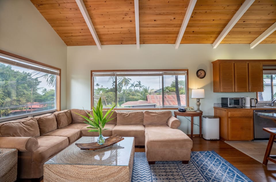 Enjoy the surrounding tropical landscape even when relaxing on the couch