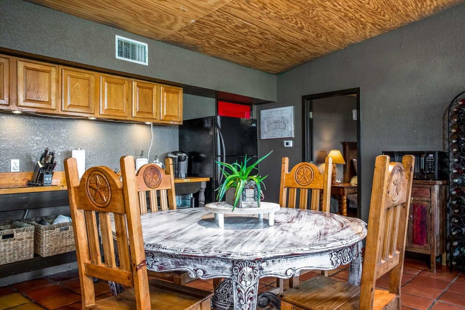 You'll find a fridge and freezer, convection oven, stove top, microwave, two kinds of coffee makers, and a toaster and crock pot in the country kitchen.