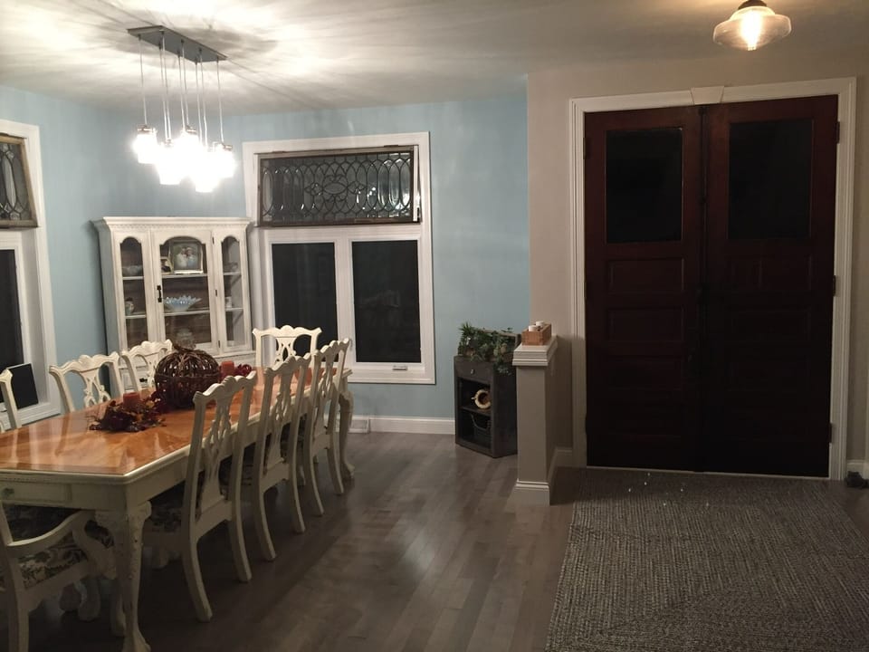 Dining space for 8. Antique leaded glass windows.