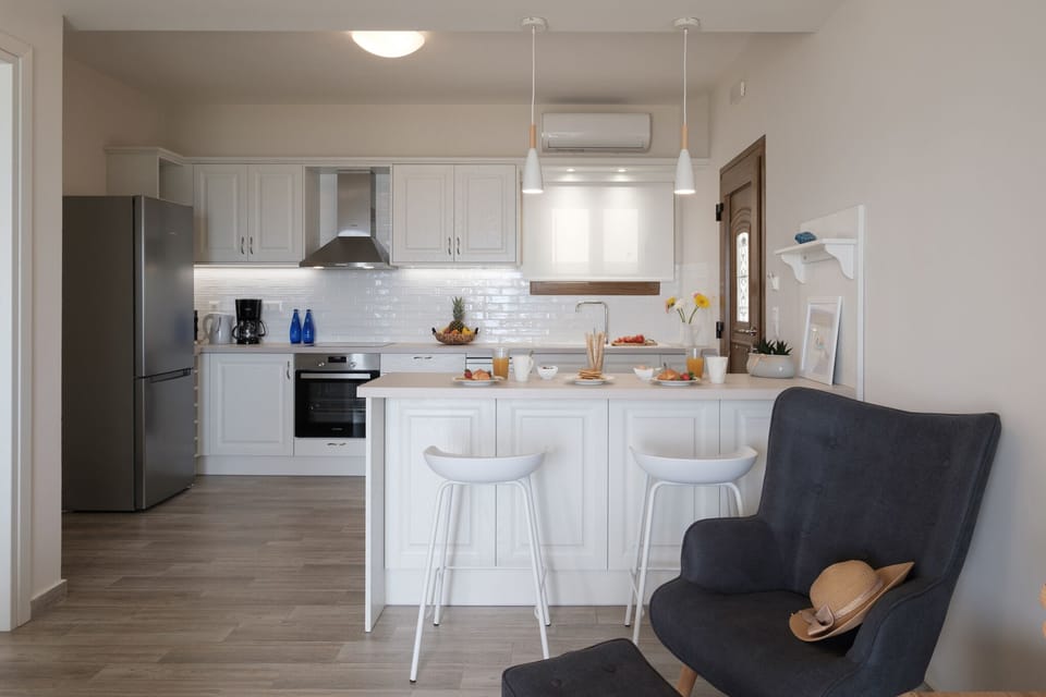 Armikes Beachfront Suite 1 Afionas Kitchen And Dining Area 