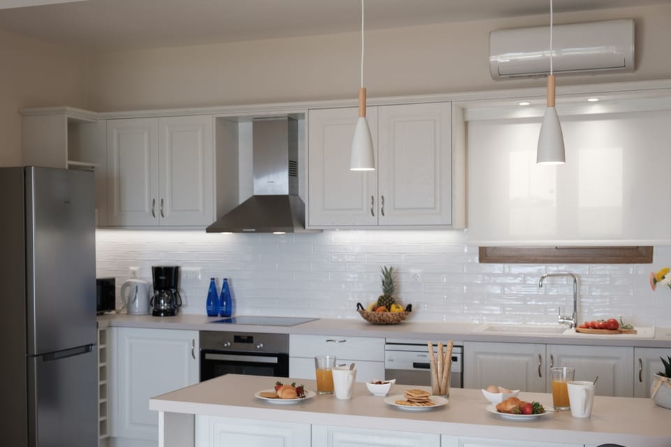 Armikes Beachfront Suite 1 Afionas Kitchen And Dining Area  