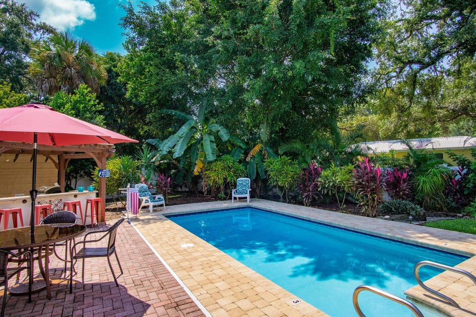 Enjoy the lush gardens at your private pool.