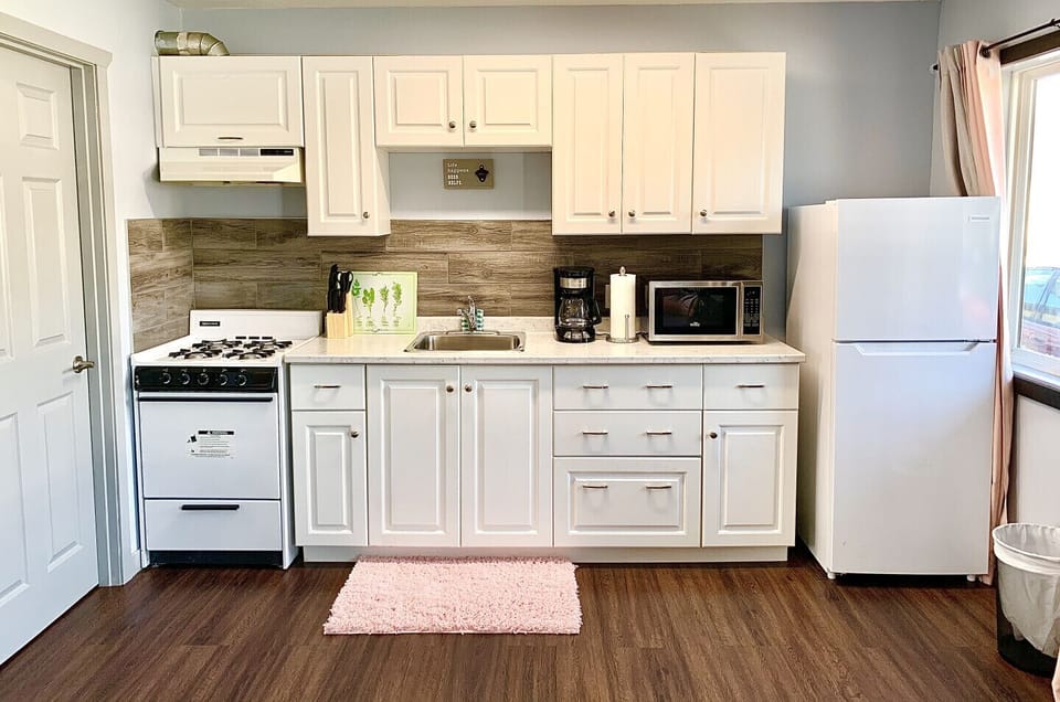 A fully equipped kitchen with a propane stove!