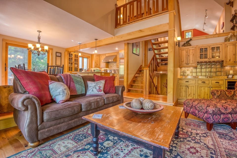 Living room featuring stunning gas fireplace and wet bar