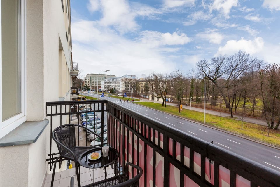 The balcony's stylish decor complements the apartment's modern design.