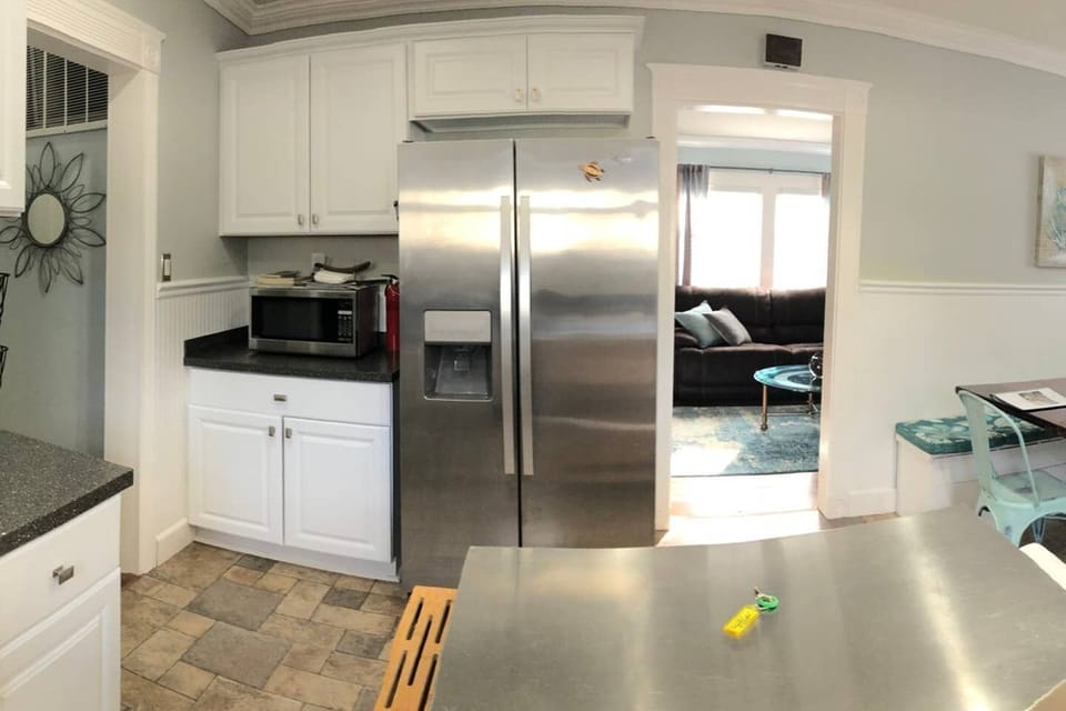 Kitchen: Pictured is our two-door refrigerator stocked with condiments for you.