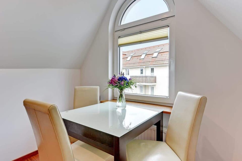 Large table with chairs for eating communal meals. 
