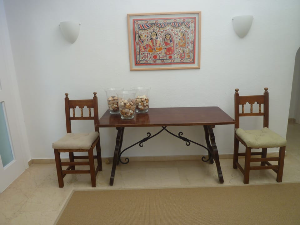 hall, side with access to guest's bathroom, master bedroom, stairs up/down