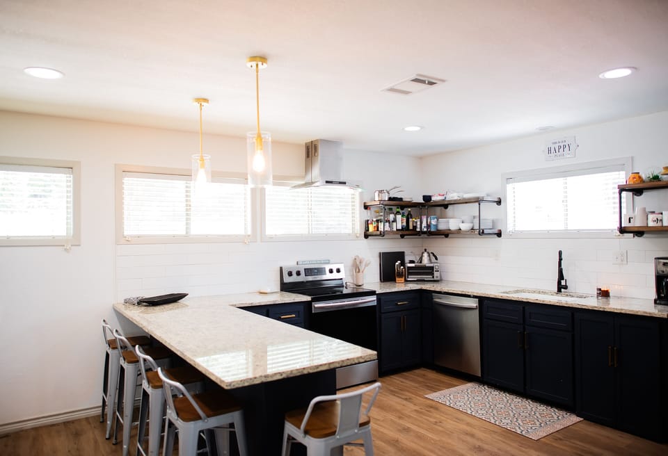 Full kitchen with stove, oven, microwave, coffee maker, toaster, and fridge