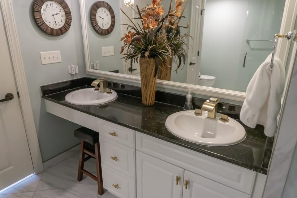 Spacious bathroom with dual sinks and elegant granite countertop