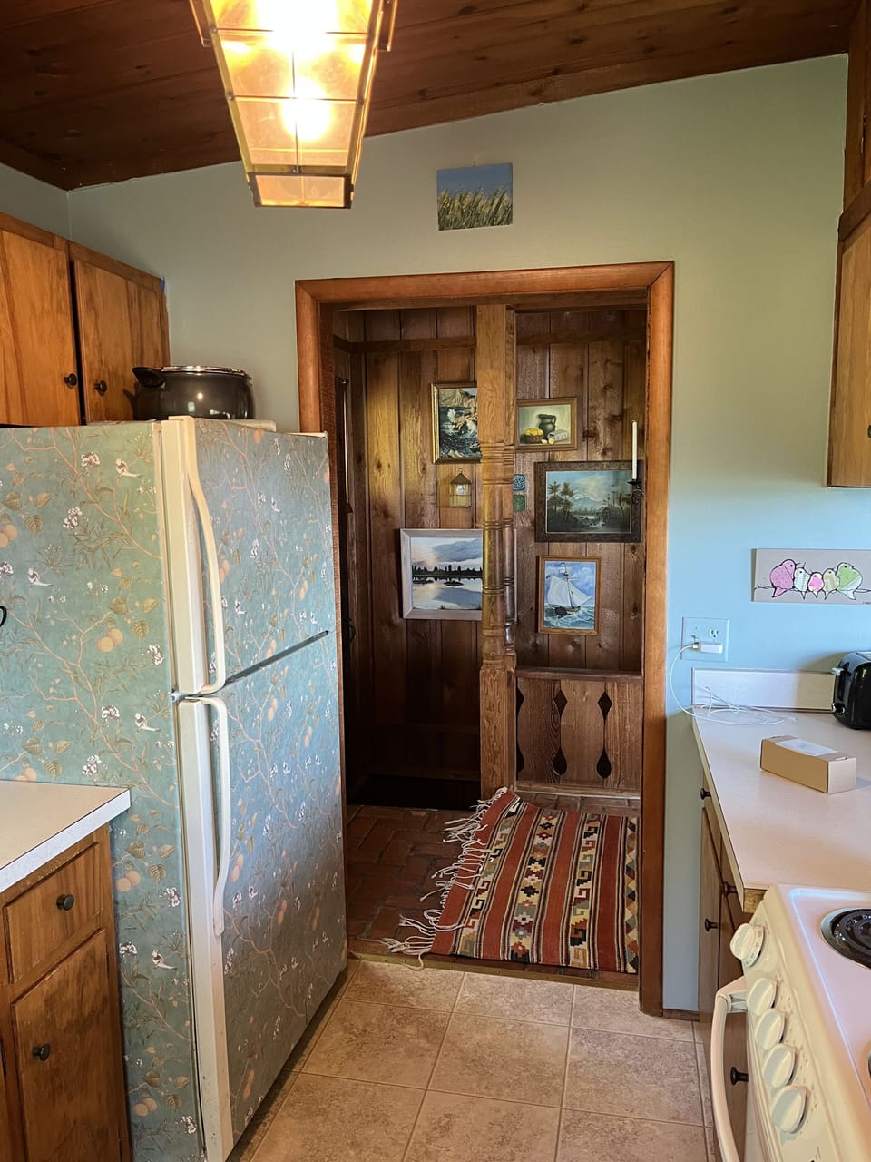 Kitchen, main floor, well-stocked, faces towards Lake MI and woods