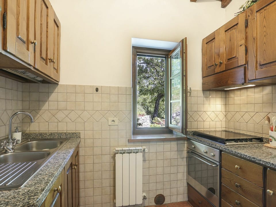Property, Room, Countertop, Tile, Cabinetry, Yellow, Kitchen, Interior Design, Building, Furniture
