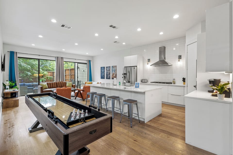 Open concept chef's kitchen and full size shuffle board