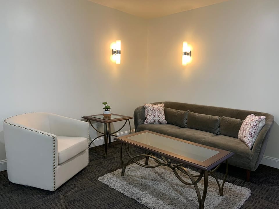 Bedroom Four - small living area 