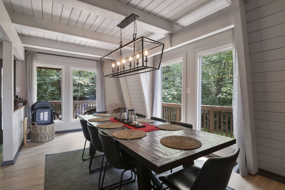Dining area seats up to 10. Sidebar has plenty of glasses and dishes.
