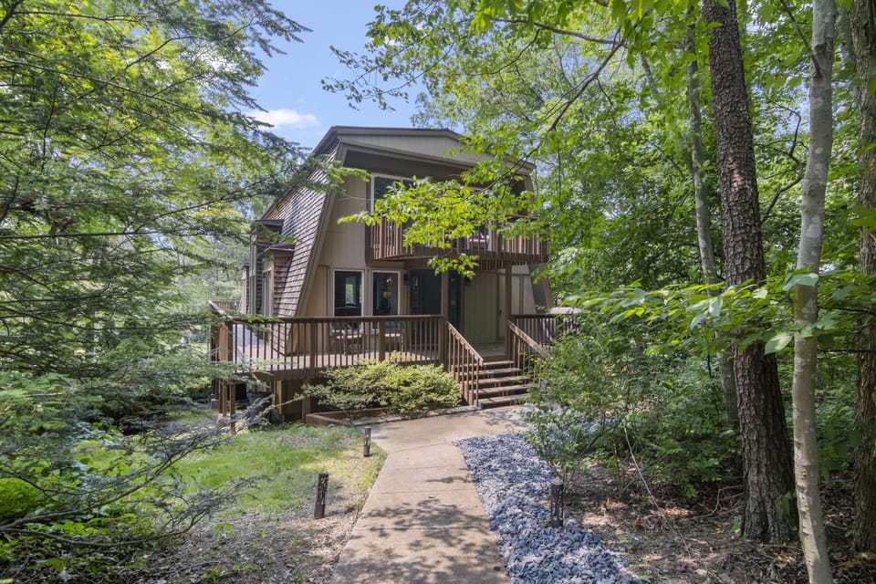 Entry way of home from private parking area.  Peaceful wooded area in front.