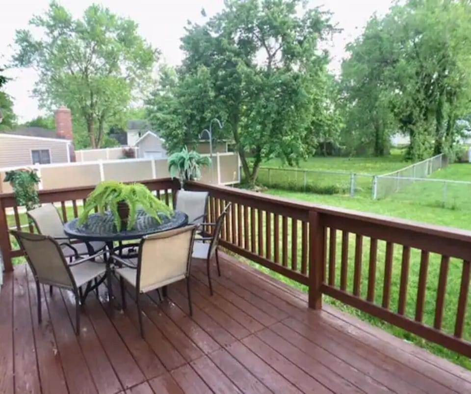 Wooden deck can be accessed from the dining room and from the kitchen.